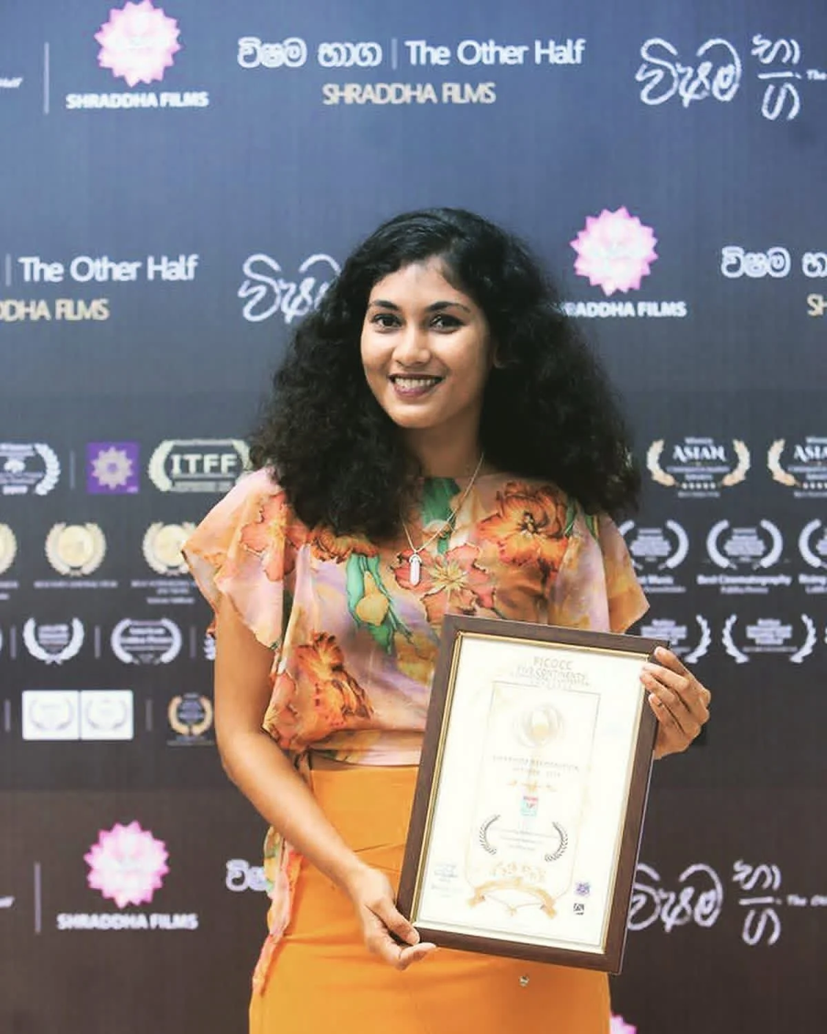 Thilakshini Ratnayake with the FICOCC Venezuela laureate certificate